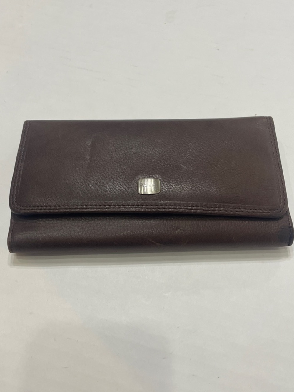 Vintage Rolf’s Brown Leather Trifold Wallet with Silver Logo Plate. Preowned.